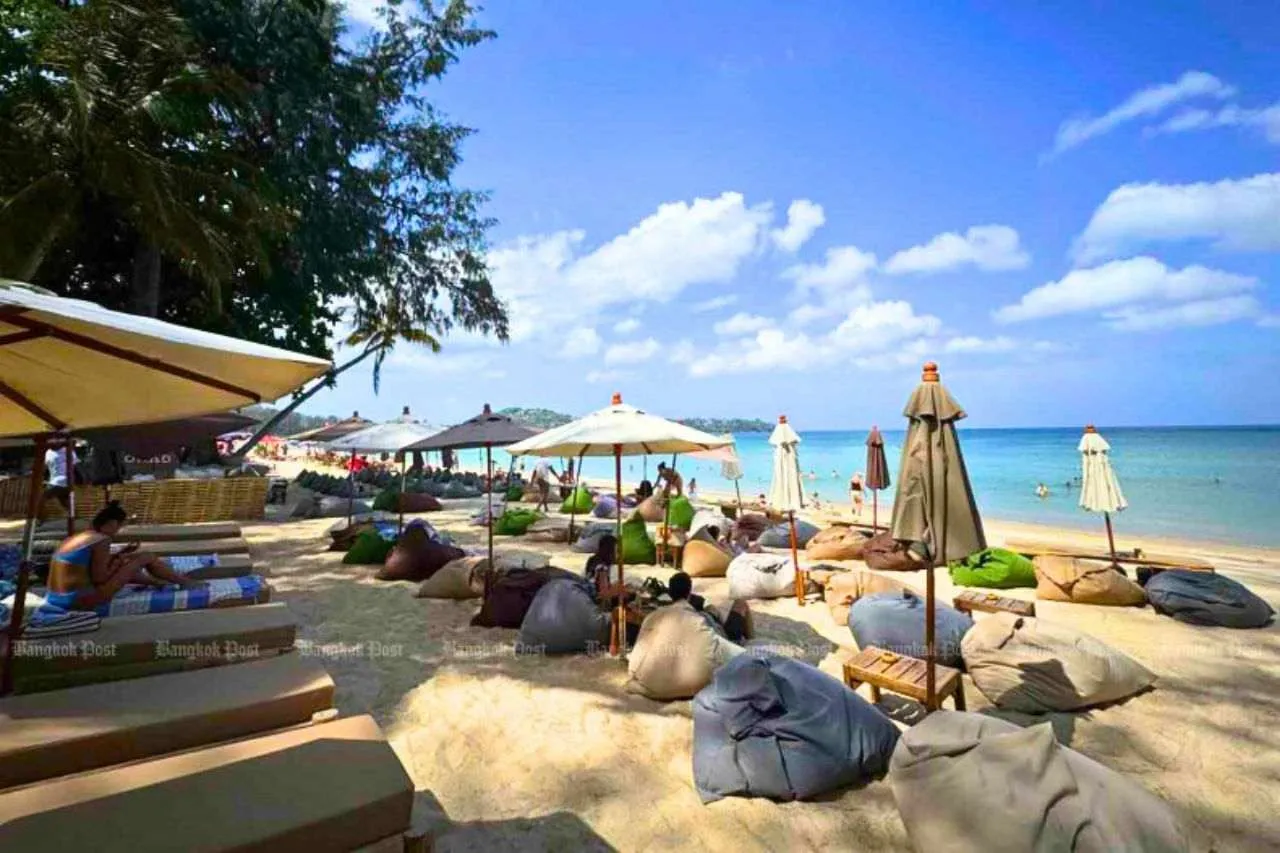 Tourists on Bangtao beach in Phuket.